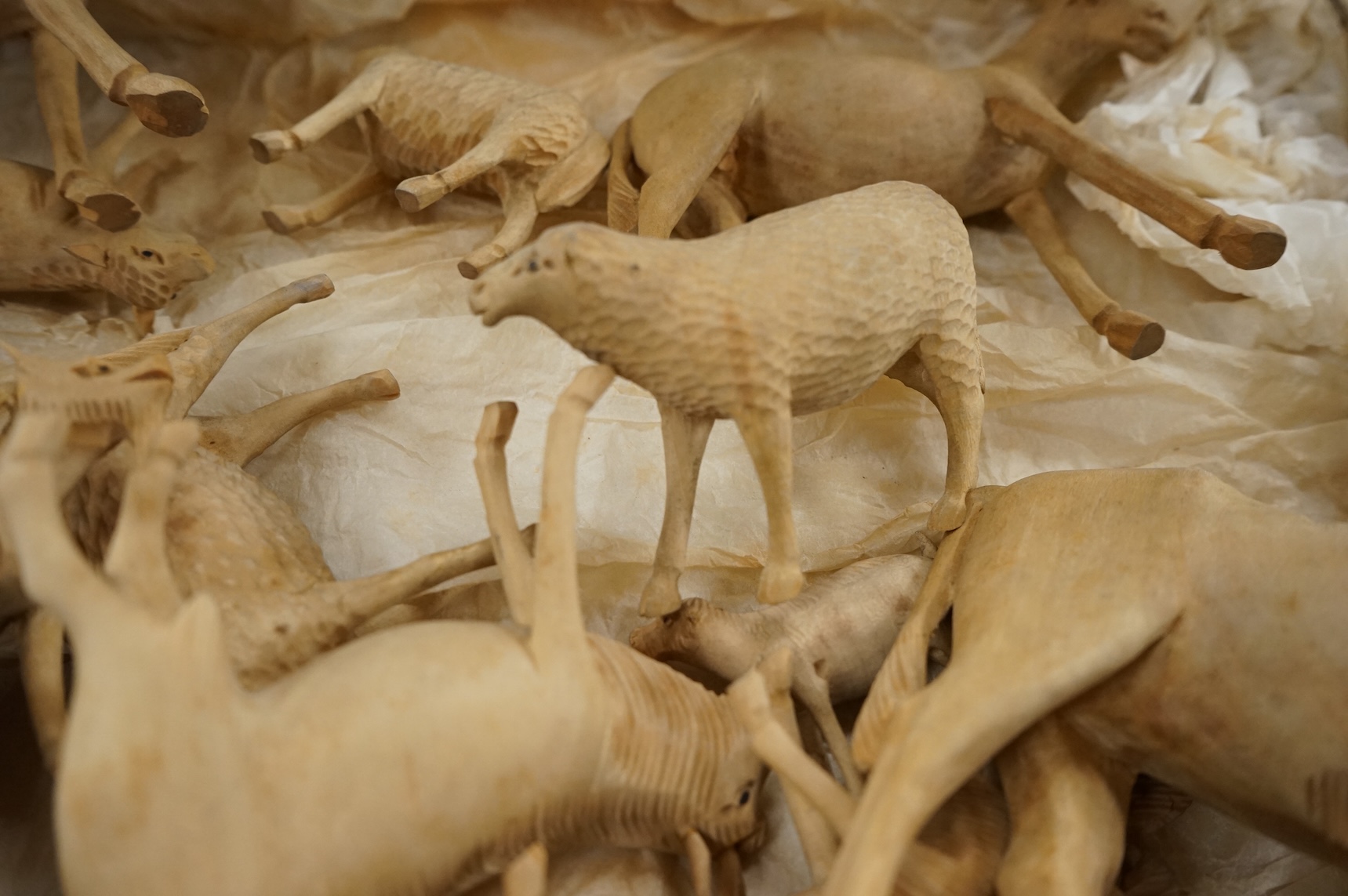 A collection of carved wood farm animals, largest 15.5cm